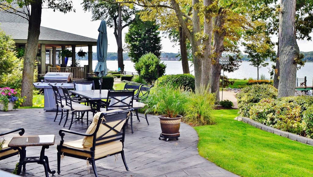 Patio outdoor living space on the lake with beautiful landscape design